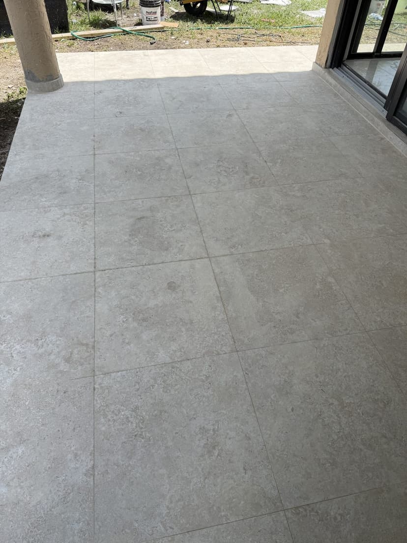 Finished patio floor in stone-look porcelain.