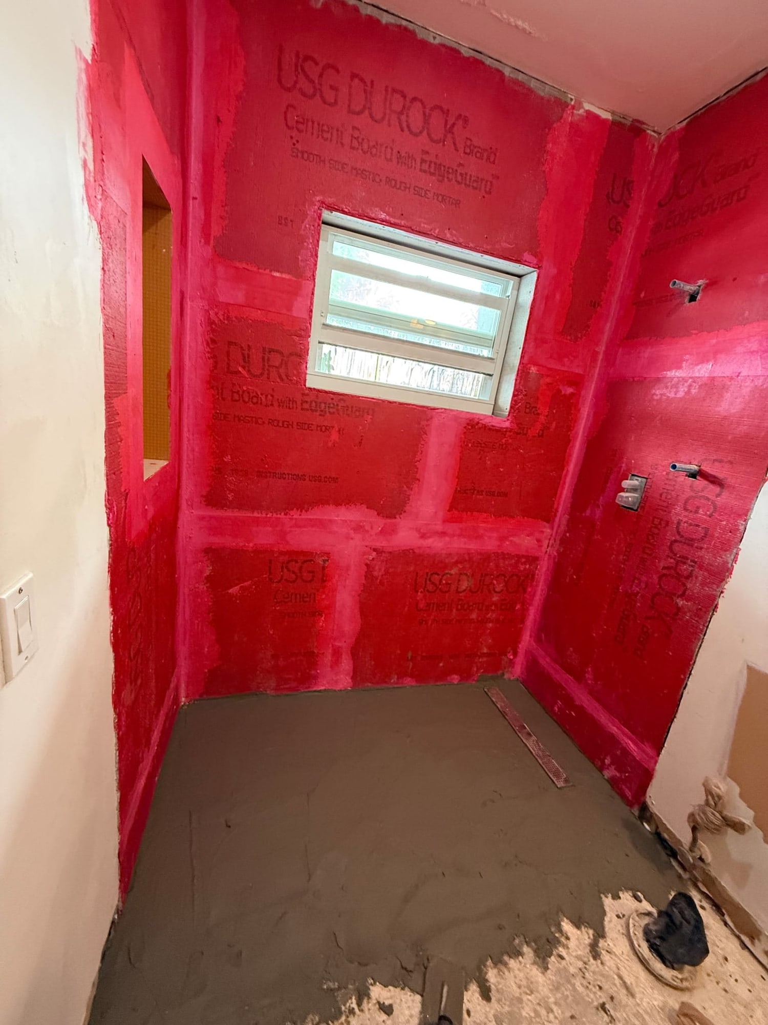 Waterproofing membrane applied in a shower before tile